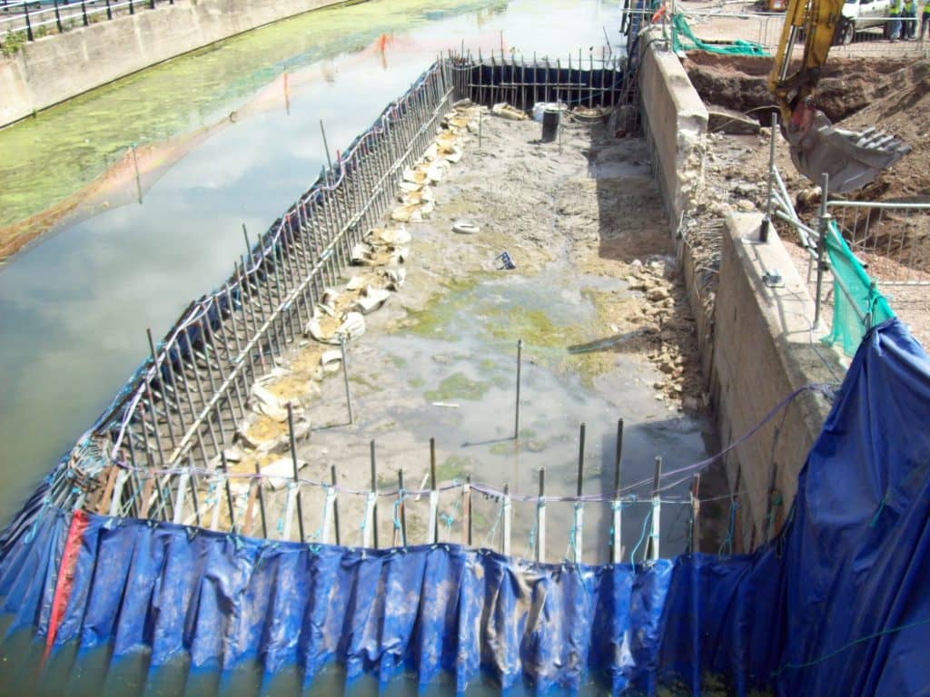 Portadam Temporary dam system being used to allow a outfall into a
