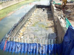 Portadam Temporary dam system being used to allow a outfall into a river to be constructed