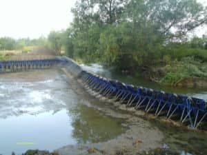 Channel diversion using a portadam temporary dam system