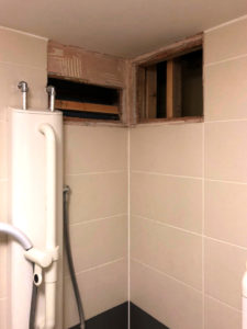 Ceiling removed in tenant's bathroom to find leak
