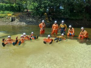 PortaDam team in water wearing drysuits